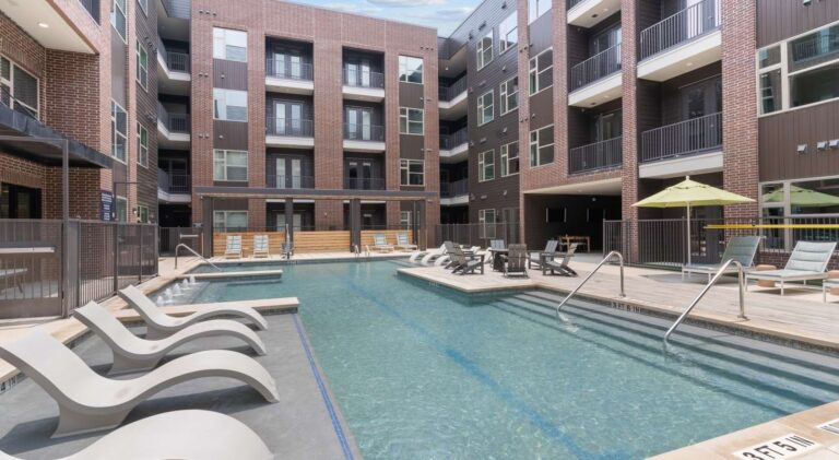 Alloy Austin apartments pool courtyard and building exterior, Austin